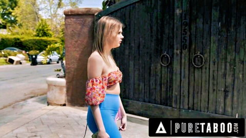 Blonde teen in skimpy floral off-shoulder top and tight blue shorts teasing her ass outdoors