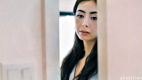 Nicole Doshi seductively peeks through door in low-cut white top, Adult Time