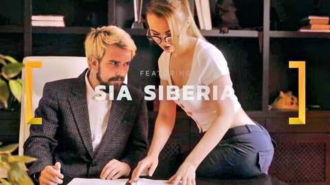 Blonde Sia Siberia in tight pants bends over office desk showing ass to suited boss