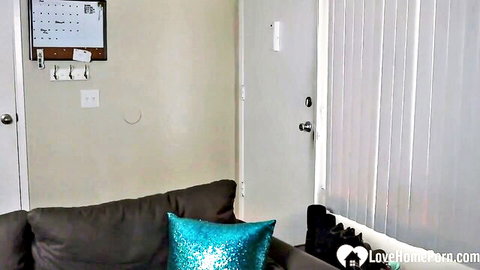 Cozy apartment room corner with gray couch, teal pillow, bulletin board ready for employee creampie fuck