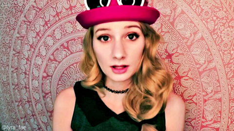 Lyra Fae in seductive Pokémon cosplay, pink hat and black dress fantasy