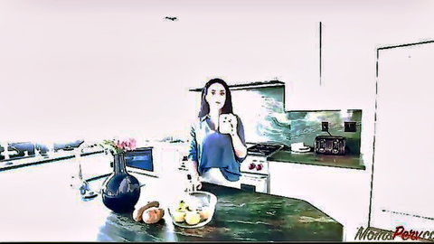 Brooke Beretta in blue dress taking teasing selfie on kitchen table