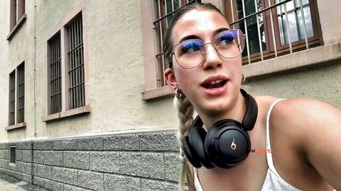 Blonde teen with pigtails blue glasses Bose headphones open mouth sexy POV selfie outdoors