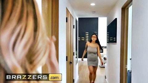 Blonde and Asian babes in tight gray dresses strut down hallway teasing for hardcore threesome fuck