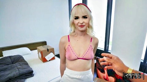 Blonde Lilly Bell in pink bra and white shorts posing seductively