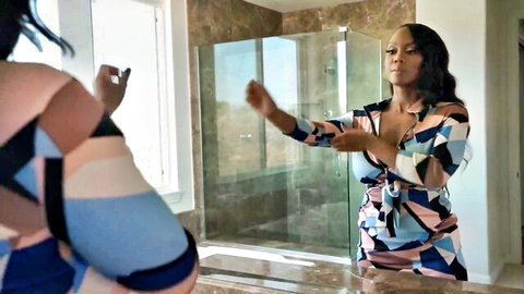 August Skye poses in colorful low-cut dress, big tits on display