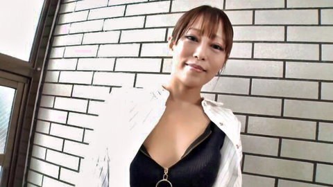 Braless Asian neighbor smiling with deep cleavage in unbuttoned white shirt over black top