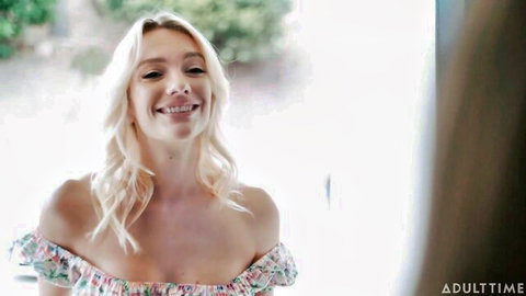 Anna Claire Clouds smiling seductively in floral off-shoulder dress