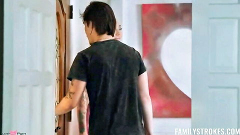 Stepbrother in black tee turns at door during steamy threesome setup