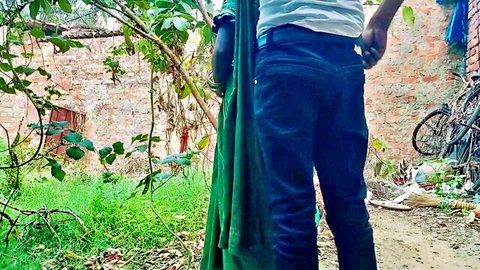 Sexy Indian babe in tight jeans showing white underwear peeking out in outdoor backyard