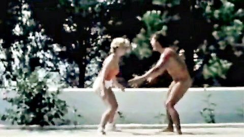 Retro blonde in red swimsuit teases nude hunk by pool in vintage hardcore scene