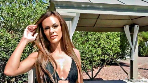 Brunette beauty in fringed black bikini tans seductively outdoors, begging for cum