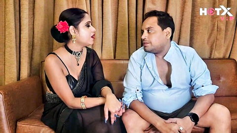 Desi bhabhi in black saree seducing devar with hand on thigh