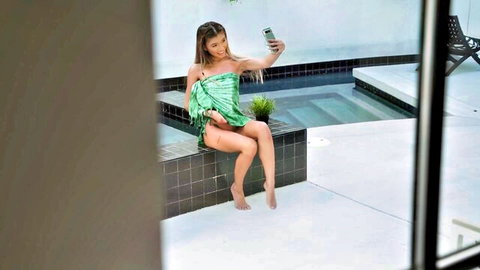 Clara Trinity sexy selfie in green sarong by pool