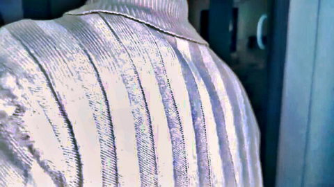 Mathilda back view in striped turtleneck sweater, teasing seeker vibe