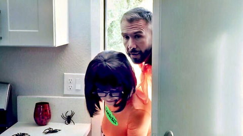 Velma cosplay babe with big tits in orange sweater surprised by peeking stud