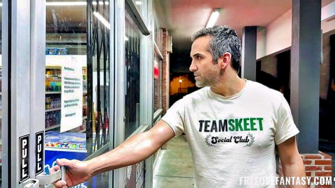 Man in Team Skeet Social Club t-shirt opening store door entrance