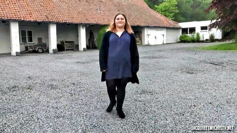 Manon BBW redhead in blue dress and black coat outdoors
