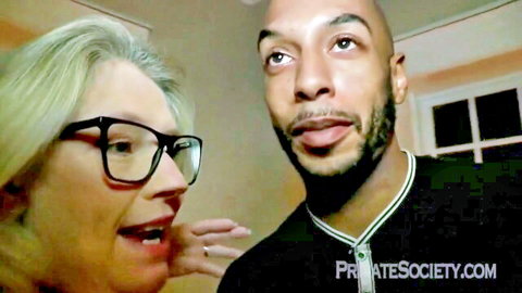 Blonde mature GILF wife with glasses touching BBC stud's face closeup