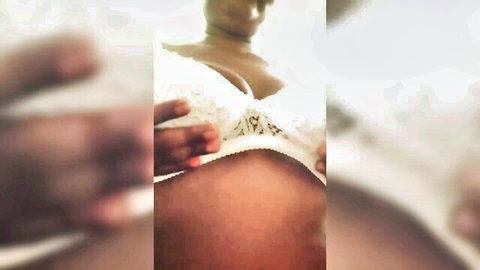 Indian aunty in white lace lingerie exposing large breasts and belly during erotic massage