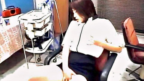Asian nurse in white uniform hikes black skirt spreading legs wide on chair teasing pussy