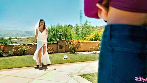 Bride in high-slit white wedding dress flashes thigh while woman in tight purple jeans shows off ass outdoors