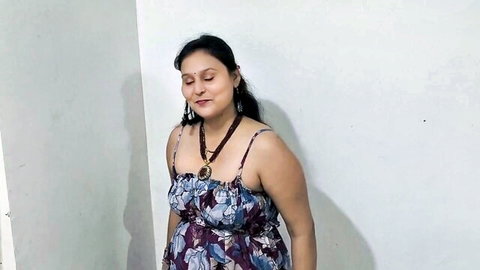 Pujapremlove, seductive Desi MILF in floral dress, smiling warmly