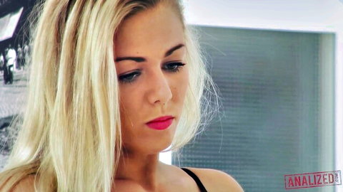 Seductive blonde with plump red lips and blue eyes teasing closeup