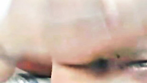 Close-up of woman's intense dilated eye with heavy mascara during rough sex ecstasy