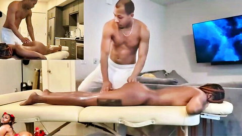 Muscular black masseur oils and massages naked ebony woman's bare juicy ass and thighs