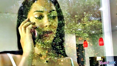 Jasmine Lotus in seductive green-tinted phone call tease