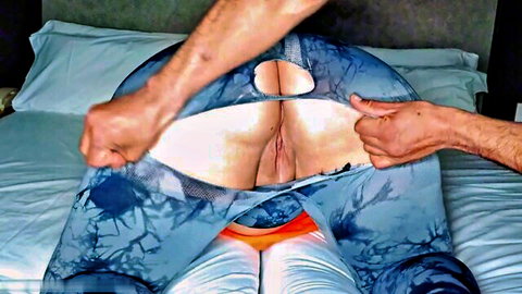 Man's hands spread thick woman's ass cheeks wide exposing pink pussy and tight asshole on bed