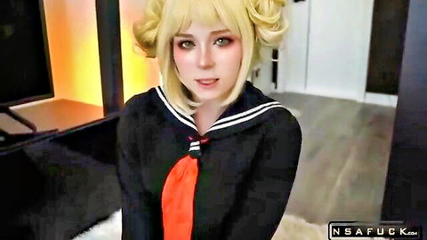Blonde Himiko Toga cosplay babe in tight black sailor uniform smiling seductively