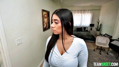 Violet Myers in low-cut white top showcasing huge cleavage