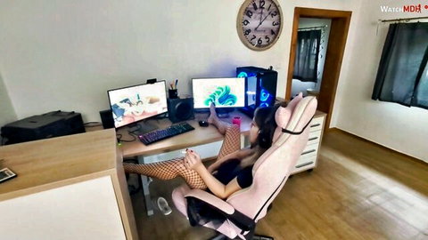 Gamer girl in fishnet stockings spreads legs wide in pink gaming chair at RGB PC desk with hentai monitors