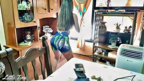 Green-haired babe bends over kitchen table in tiny leaf shorts teasing juicy ass cheeks