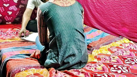 Indian woman kneels doggystyle on bed as man gropes her tits from behind in naughty tease