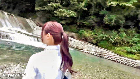 Sexy Asian Angel 16635 in white shirt and ponytail by waterfall