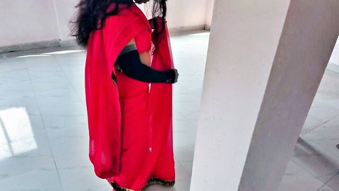 Curvy Indian babe in tight red saree posing sideways showing big ass and hips