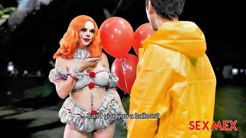 Emily Thorne as sexy redhead clown in skimpy Halloween outfit offering balloons