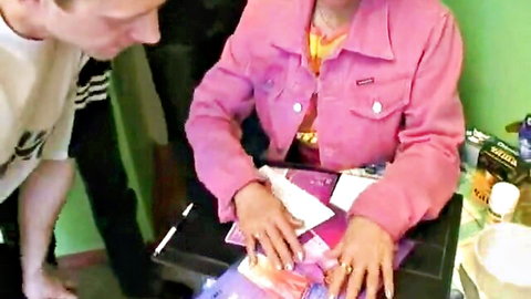 Mature Russian woman in pink jacket persuaded by young man for gangbang