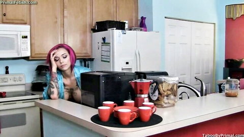 Pink-haired tattooed MILF with huge tits exposed in sheer robe leans seductively on kitchen counter