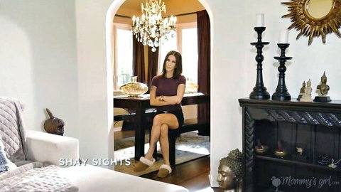 Shay Sights seated elegantly in maroon top and skirt, Mommys Girl lesbian teaser