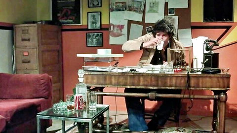Vintage Beate Uhse porn scene: curly-haired man in office vest drinks, hinting at naughty husband with teen and medium boobs