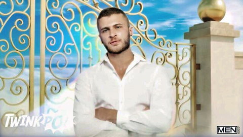Felix Fox poses confidently in white shirt before golden heavenly gates, TwinkPop gay scene