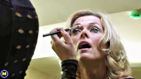 Blonde housewife intensely applying makeup in naughty solo tease