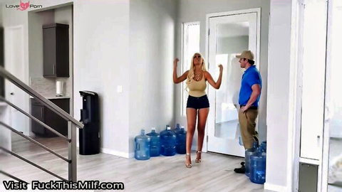 Bridgette B blonde MILF in yellow tank top and shorts posing with man