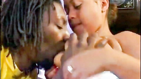 Ebony beauty passionately kissed and fondled by black lover in intimate scene