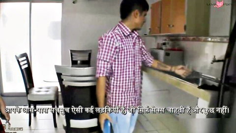 Indian man in checkered shirt washing at kitchen sink in adult video