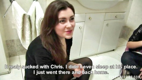Czech women in black outfits chat in bathroom about bad hookup, teasing big tits vibe